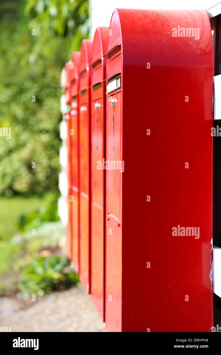 Red mail boxes in summer in sunlight Stock Photo Alamy