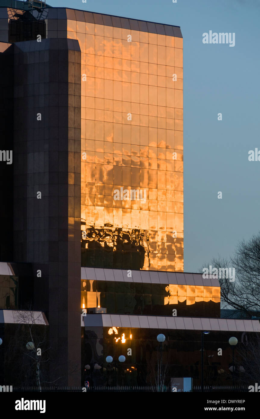 Sunset reflected in the Quay West office building, Salford Quays, Manchester, England, UK. Stock Photo