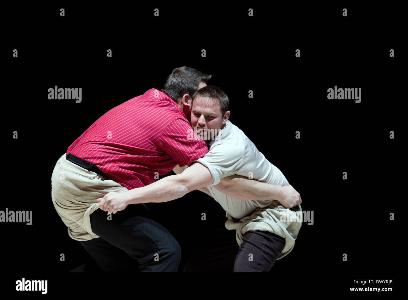 Leipzig, Germany. 14th Mar, 2014. The two Swiss wrestlers Simon Lunginbuehl (R) and Roger Bruegger, wrestle on occasion of the Leipzig Book Fair in Leipzig, Germany, 14 March 2014. Swiss wrestling, also known as Schwingen, is a style of folk wrestling native to Switzerland. Switzerland is this year's partner country of the Leipzig Book Fair. Around 2000 publishers present their novelties during the Leipig Book Fair between 13 and 16 March 2014. Photo: ARNO BURGI/dpa/Alamy Live News Stock Photo