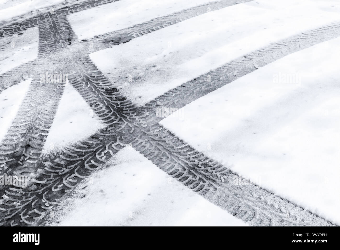 Automotive tire tracks on fresh wet snow Stock Photo