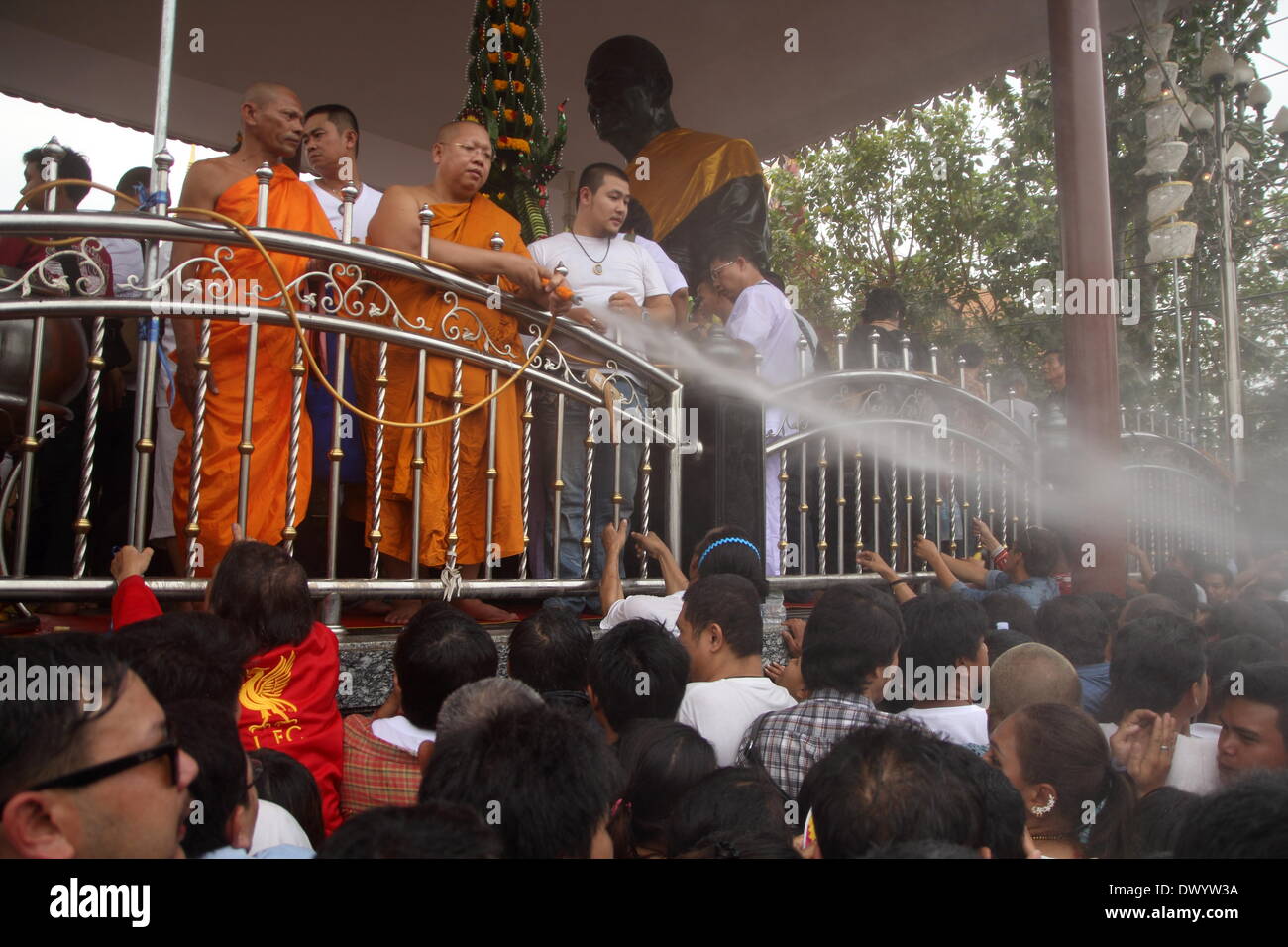 Nakhon Pathom , Thailand. 15th Mar 2014. Spraying holy water on the