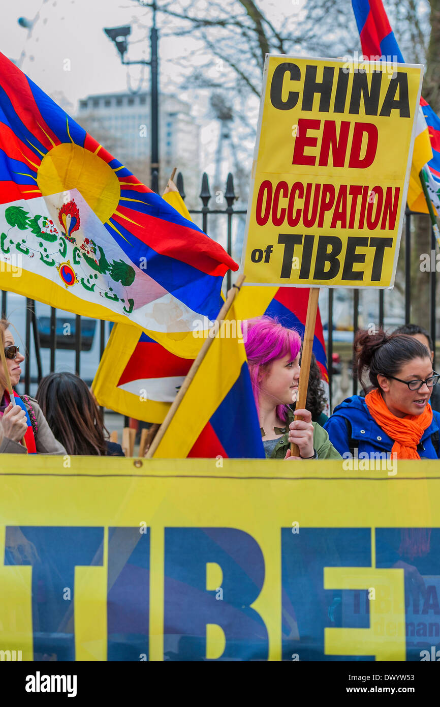 Organisations calling for a free Tibet hand in a petition to Number 10 Downing Street and then march on the Chinese embassy.  At the same time supporters of a non-Russian Ukraine try to make the UK government aware of the consequences of another super-power land grab. Whitehall, London, UK 15 March 2014. Stock Photo
