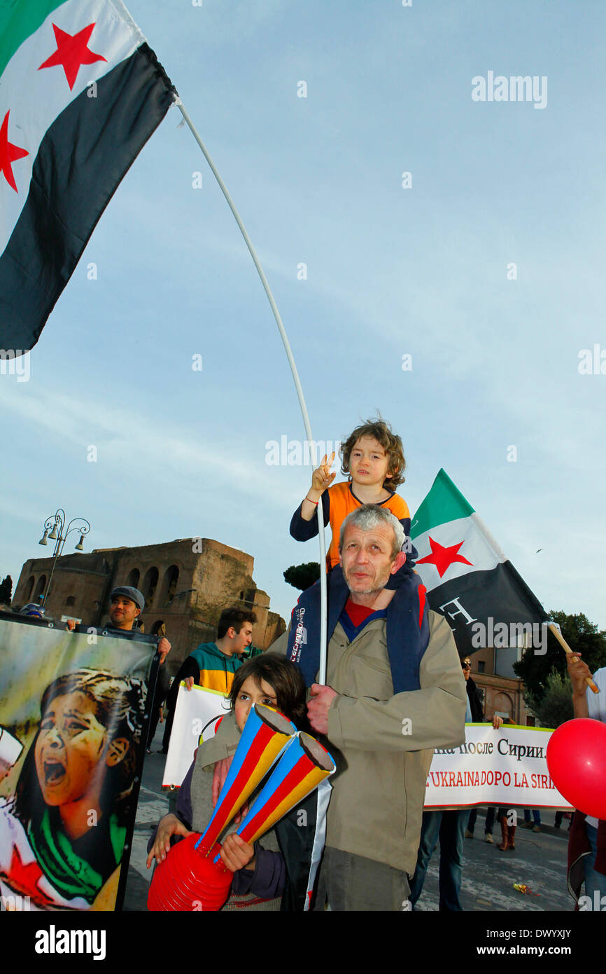 Father and son with Syrian flag during a dmo for peace in Syria. Stock Photo