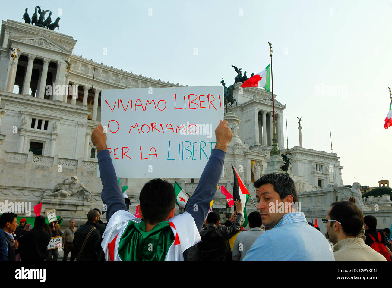 a sign with the written: 'live free or die for freedom' at Vittoriano in Rome during a demo to stop the massacres in Aleppo Stock Photo