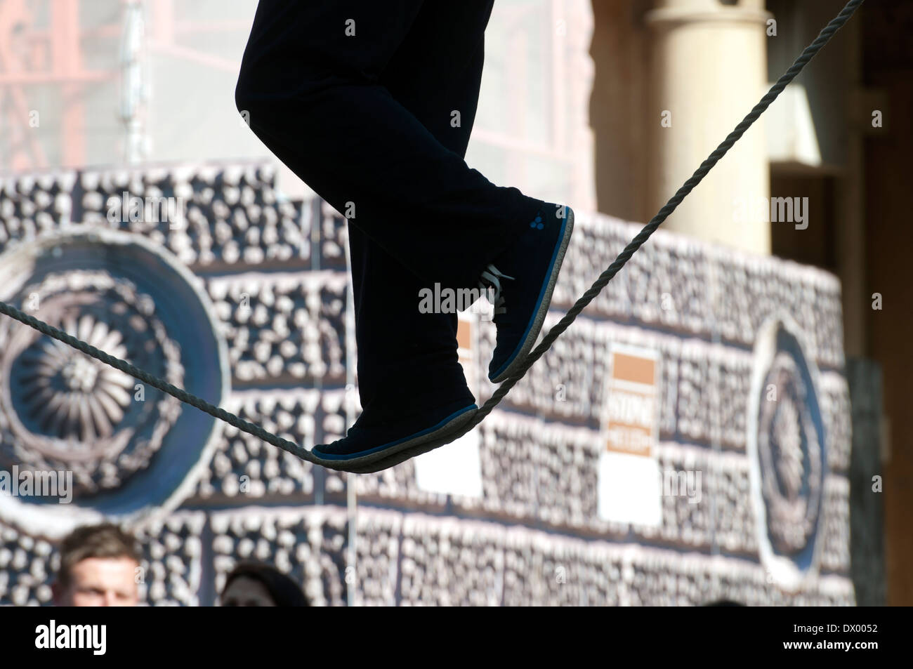 Busker on a tightrope, Bath, Somerset, England, UK Stock Photo