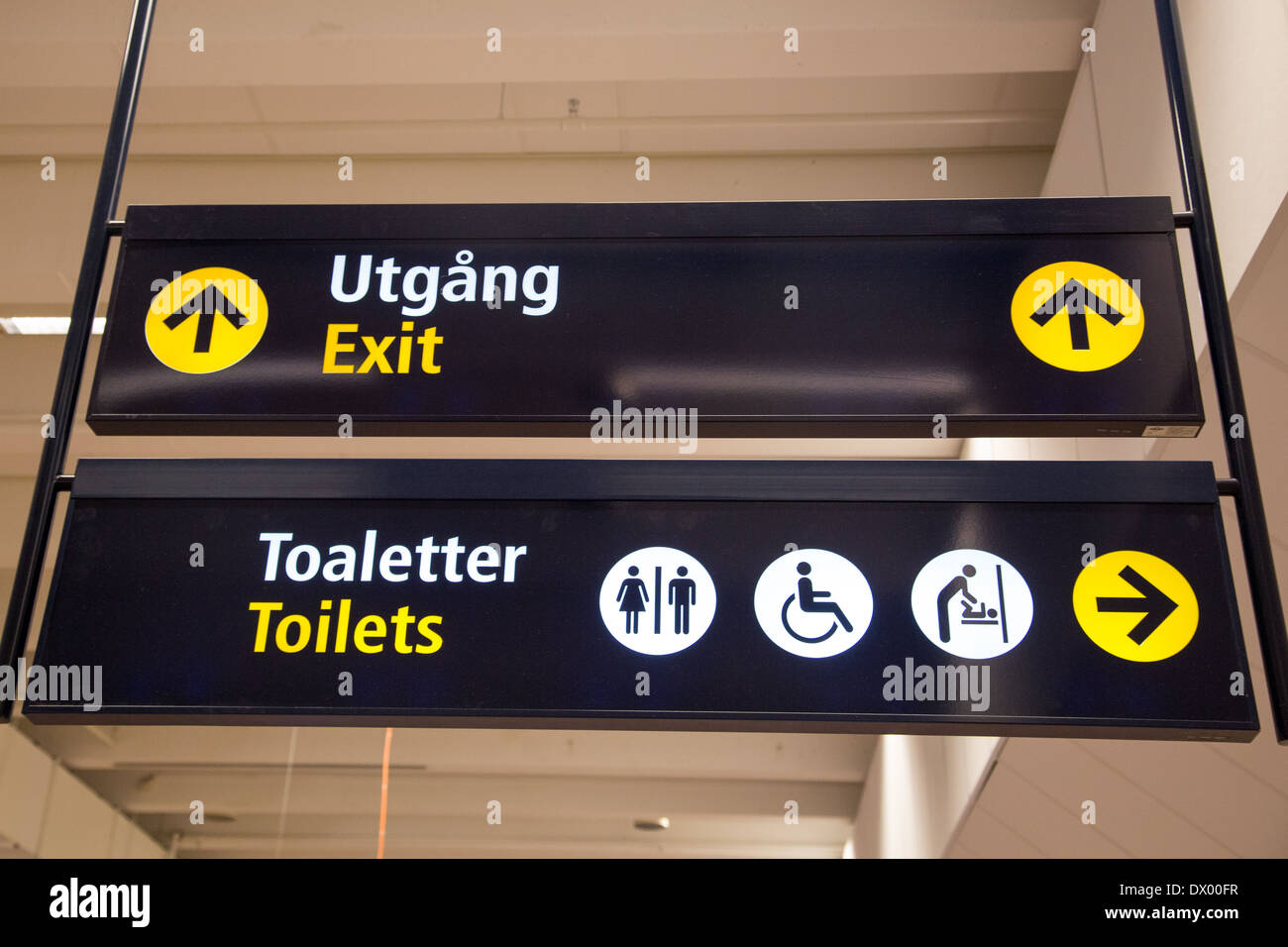 Exit (in Swedish "Utgång") and toilets (in Swedish "Toaletter") signs ...