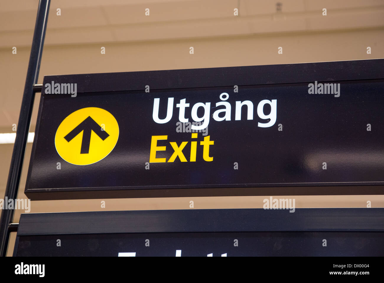 Sign with words Exit and "Utgång" (Swedish word for "Exit"). Stock Photo