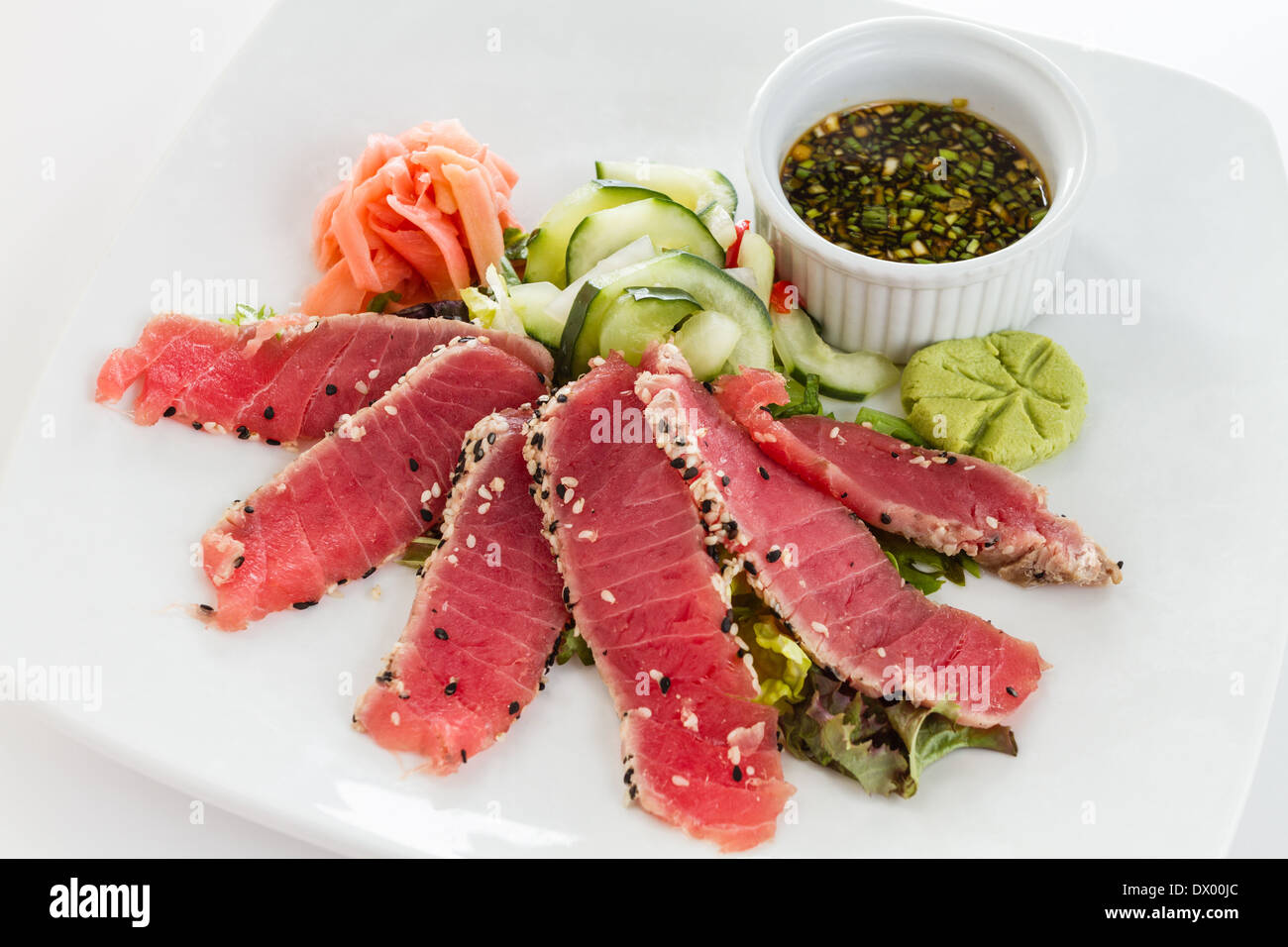 Sesame Seed Crusted Seared Tuna served with vegetables and sauce Stock