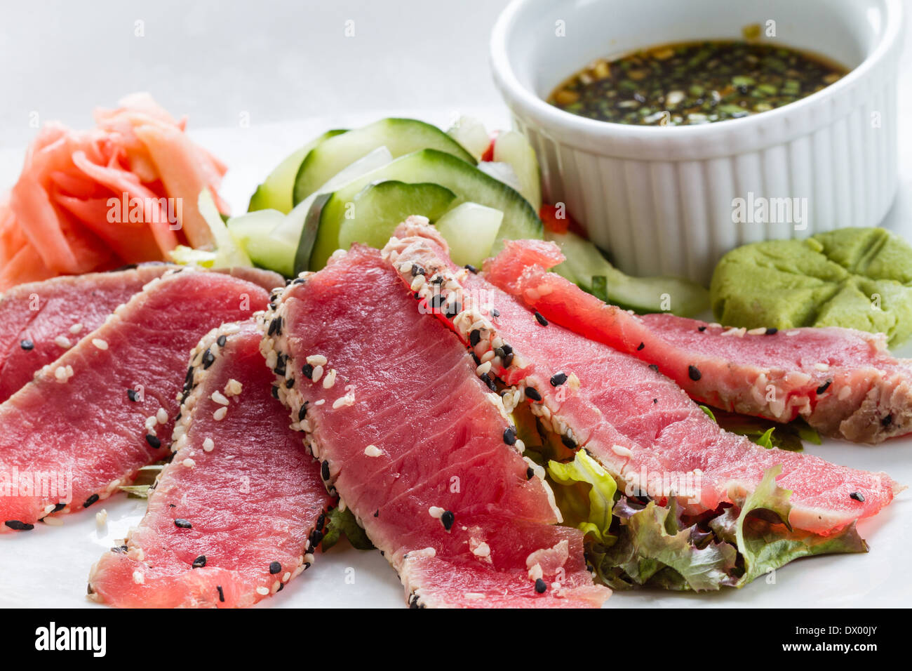 Sesame Seed Crusted Seared Tuna served with vegetables and sauce Stock