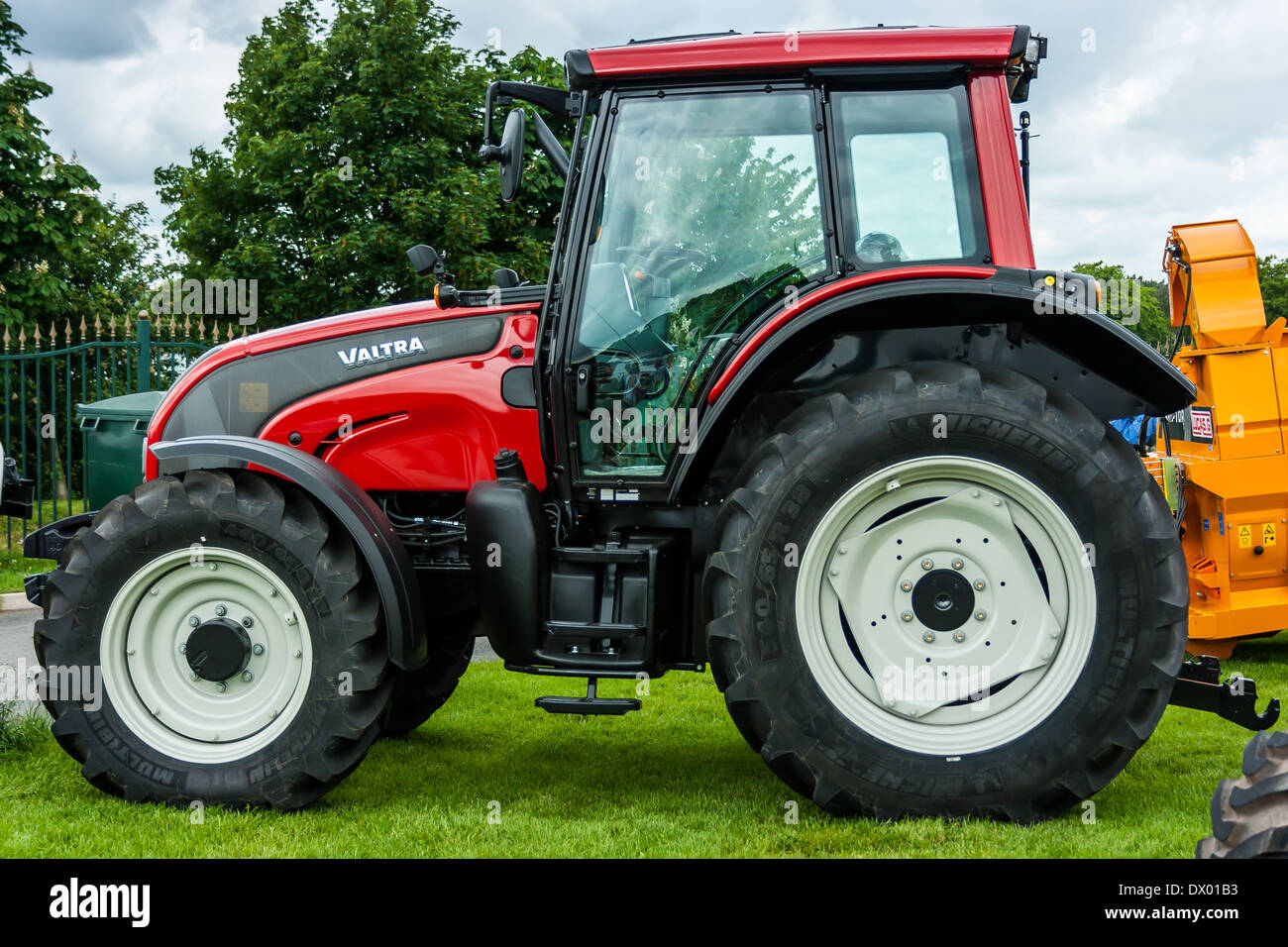Red Farming Tractor. Brand new bright shining farmers work machine