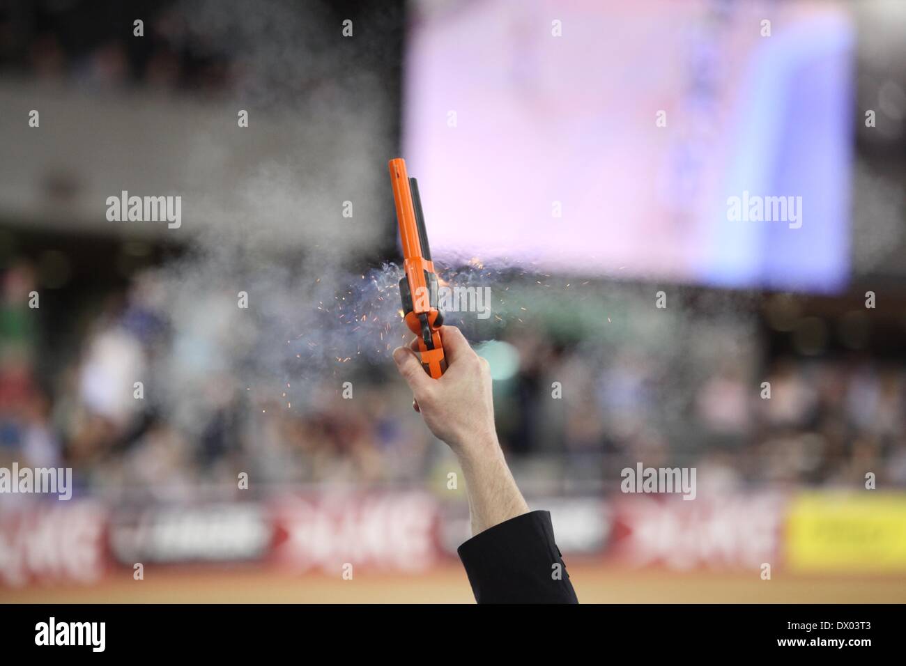 Lee Valley VeloPark, London, UK. 15th March 2014. Revolution Series Track Cycling Round 5, day 2. The referee firing the starting pistol Credit:  Neville Styles/Alamy Live News Stock Photo