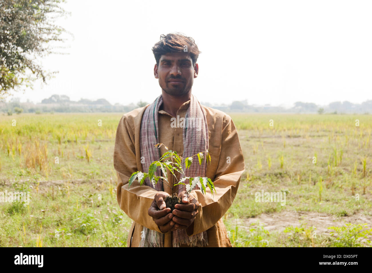 1 Indian Farmer Standing with Plant Stock Photo - Alamy