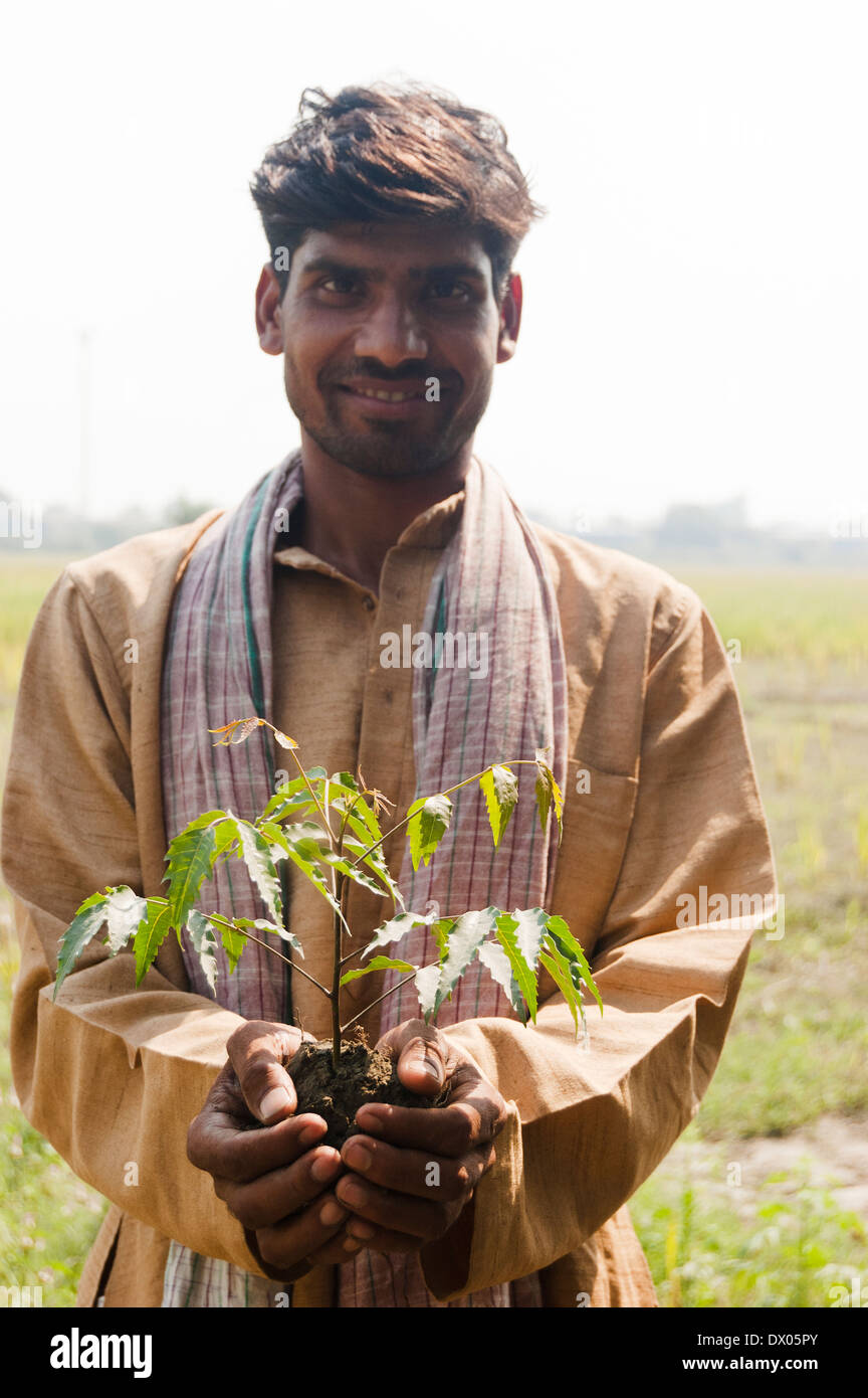 1 Indian Farmer Standing with Plant Stock Photo - Alamy