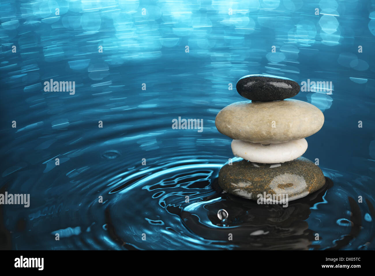 Balanced stones in water Stock Photo - Alamy