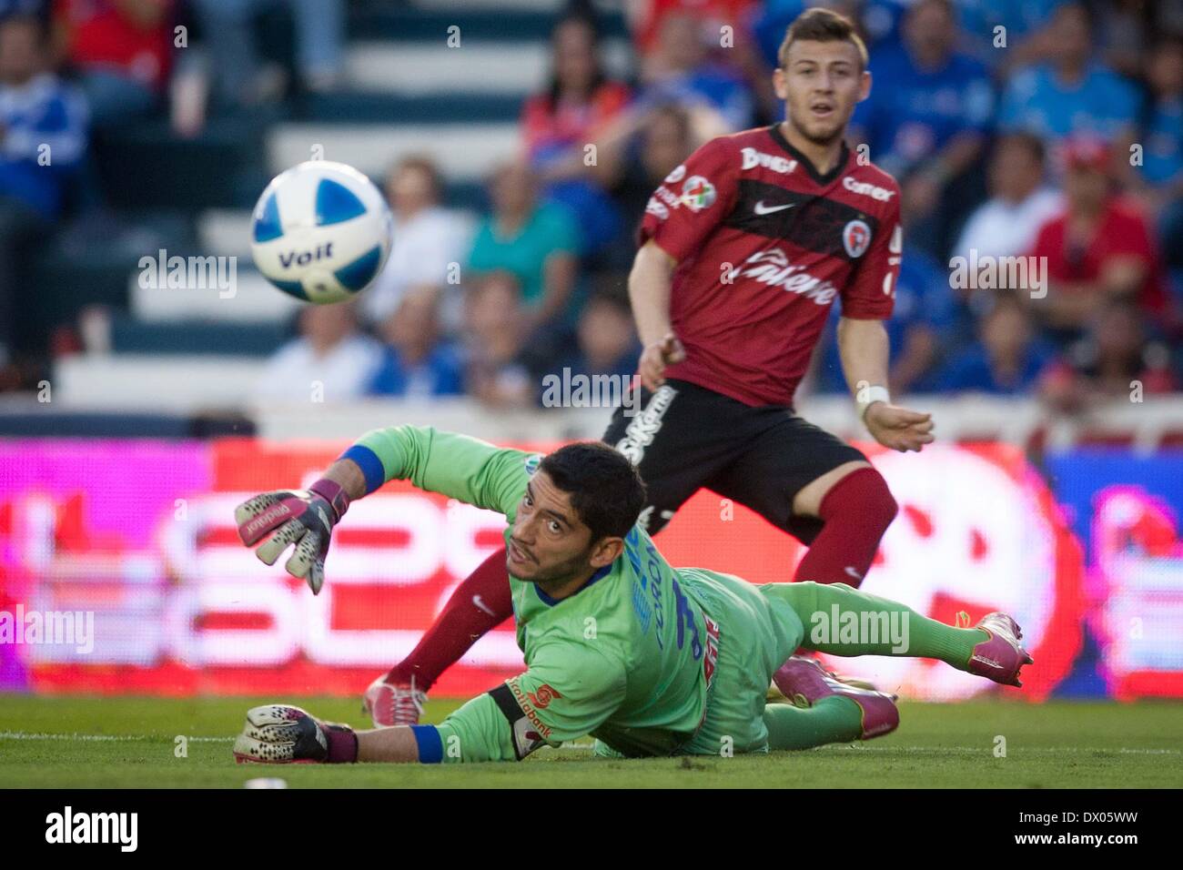 Mexico City, Mexico. 15th Mar, 2014. Cruz Azul's goalkeeper Jesus Corona (front) saves the ball during their match of the 2014 MX League Closing Tournament against Xolos, at Azul Stadium in Mexico City, capital of Mexico, on March 15, 2014. Credit:  Pedro Mera/Xinhua/Alamy Live News Stock Photo