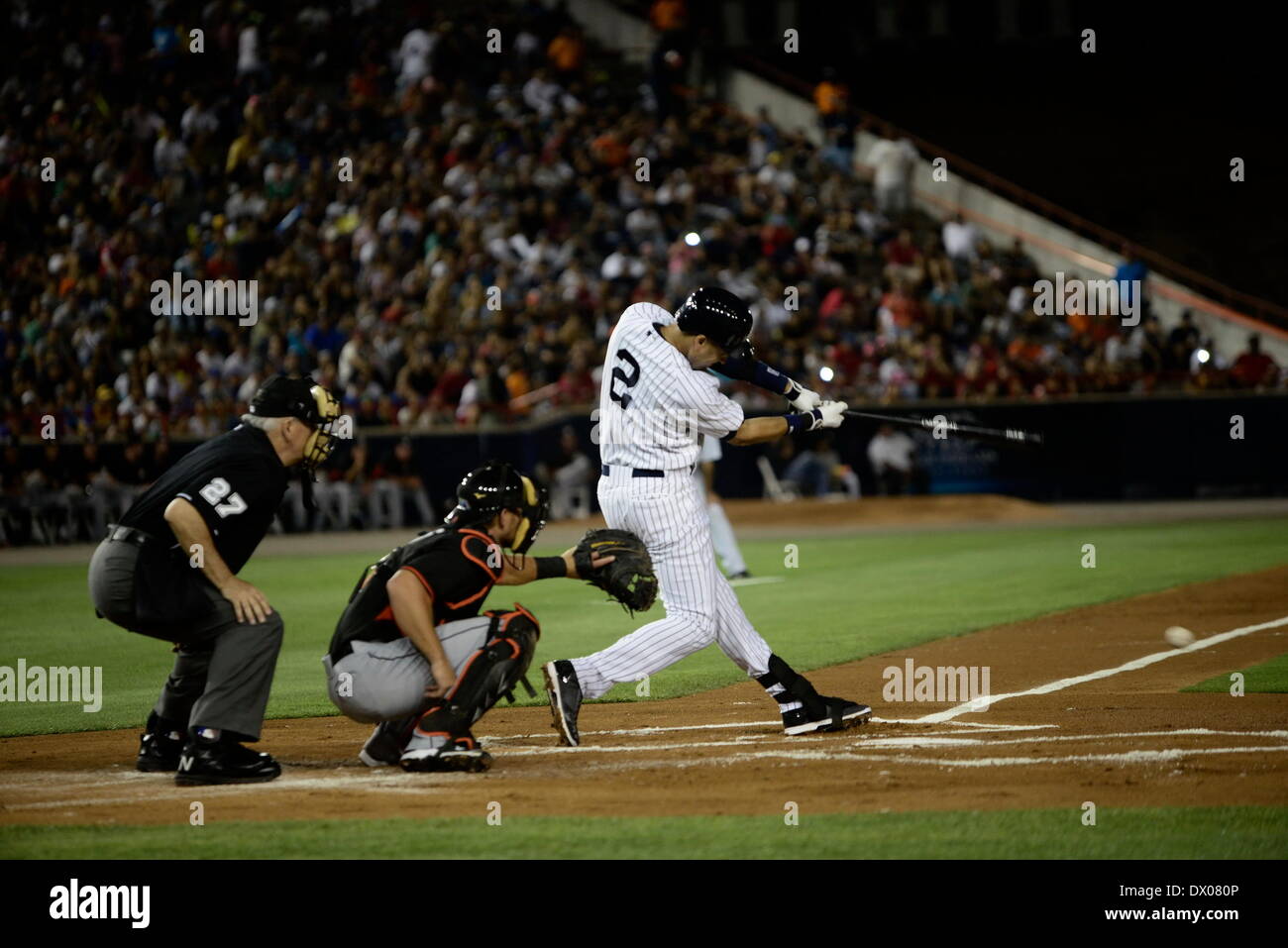 Panama City, Panama. 15th Mar, 2014. Derek Jeter(R) of the New York Yankees hits the ball during the match against Miami Marlins at Rod Carew Stadium, in Panama City, capital of Panama, on March 15, 2014. The New York Yankees and the Miami Marlins play exhibition games here in homage to Panama's former player Mariano Rivera. Credit:  Mauricio Valenzuela/Xinhua/Alamy Live News Stock Photo