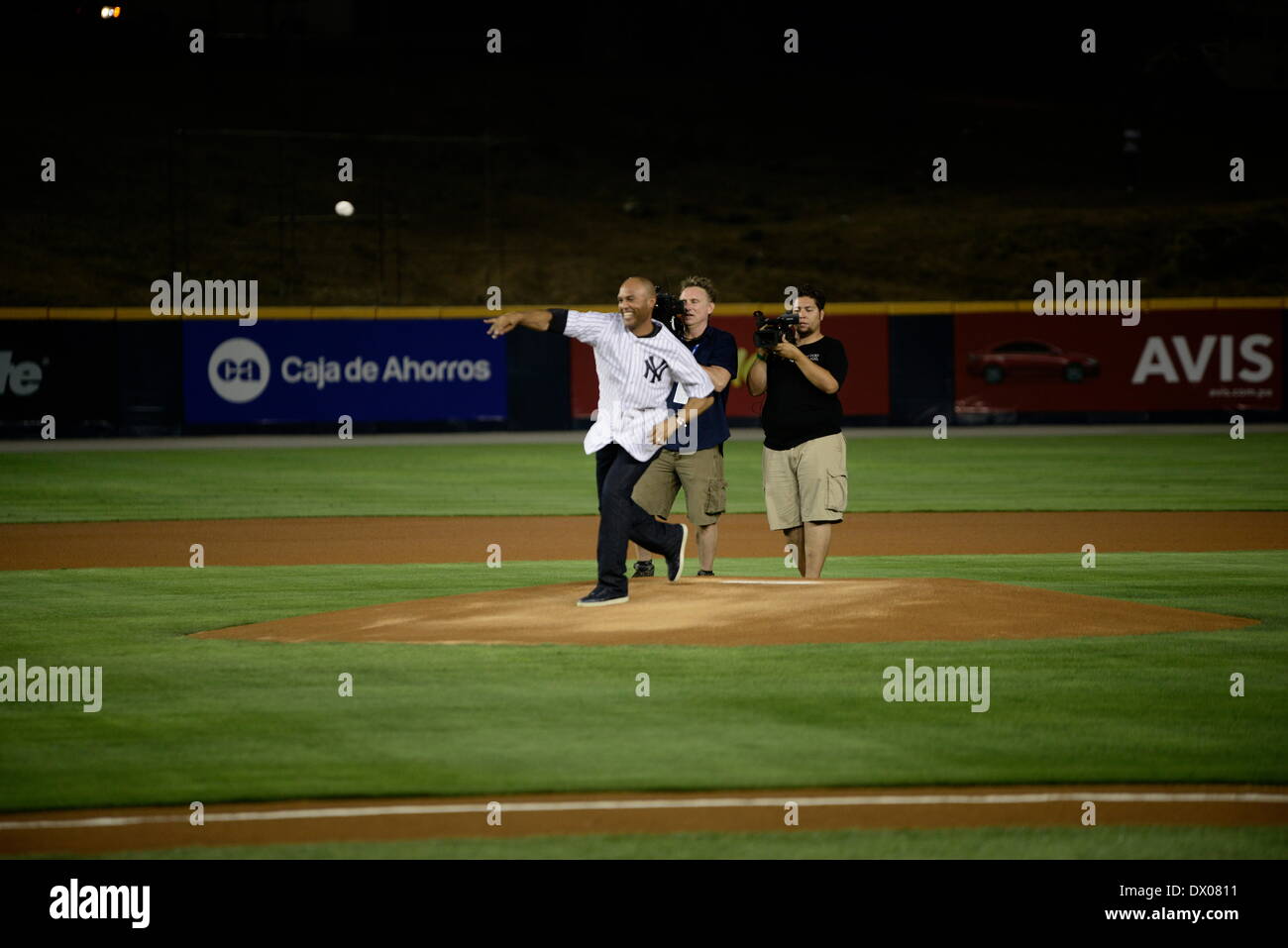 Panama City, Panama. 15th Mar, 2014. Former player of the New York Yankees, Mariano Rivera (L), throws the first pitch of the match between New York Yankees and Miami Marlins at Rod Carew Stadium, in Panama City, capital of Panama, on March 15, 2014. The New York Yankees and the Miami Marlins play exhibition games here in homage to Mariano Rivera. Credit:  Mauricio Valenzuela/Xinhua/Alamy Live News Stock Photo