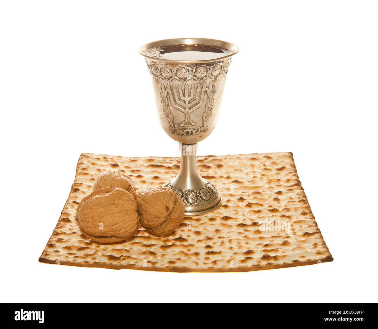 Matzoth, silver Kiddush cup and walnuts for Passover seder Stock Photo