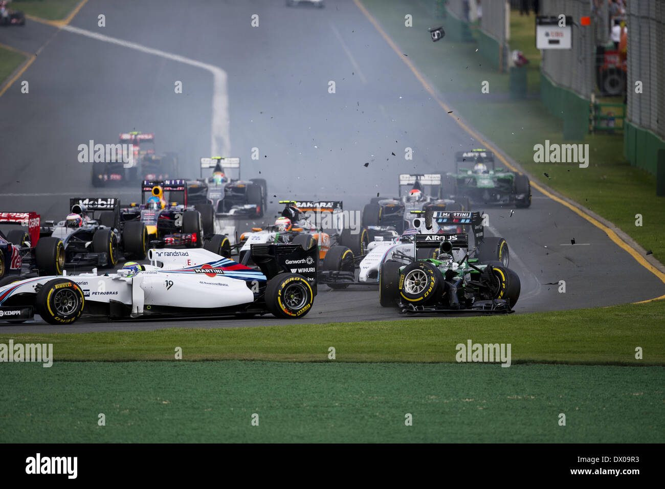 Melbourne, Australia. 16th Mar, 2014. KAMUI KOBAYASHI of Japan and Caterham F1 Team has a crash at the start of the Australian Grand Prix at Albert Park Circuit in