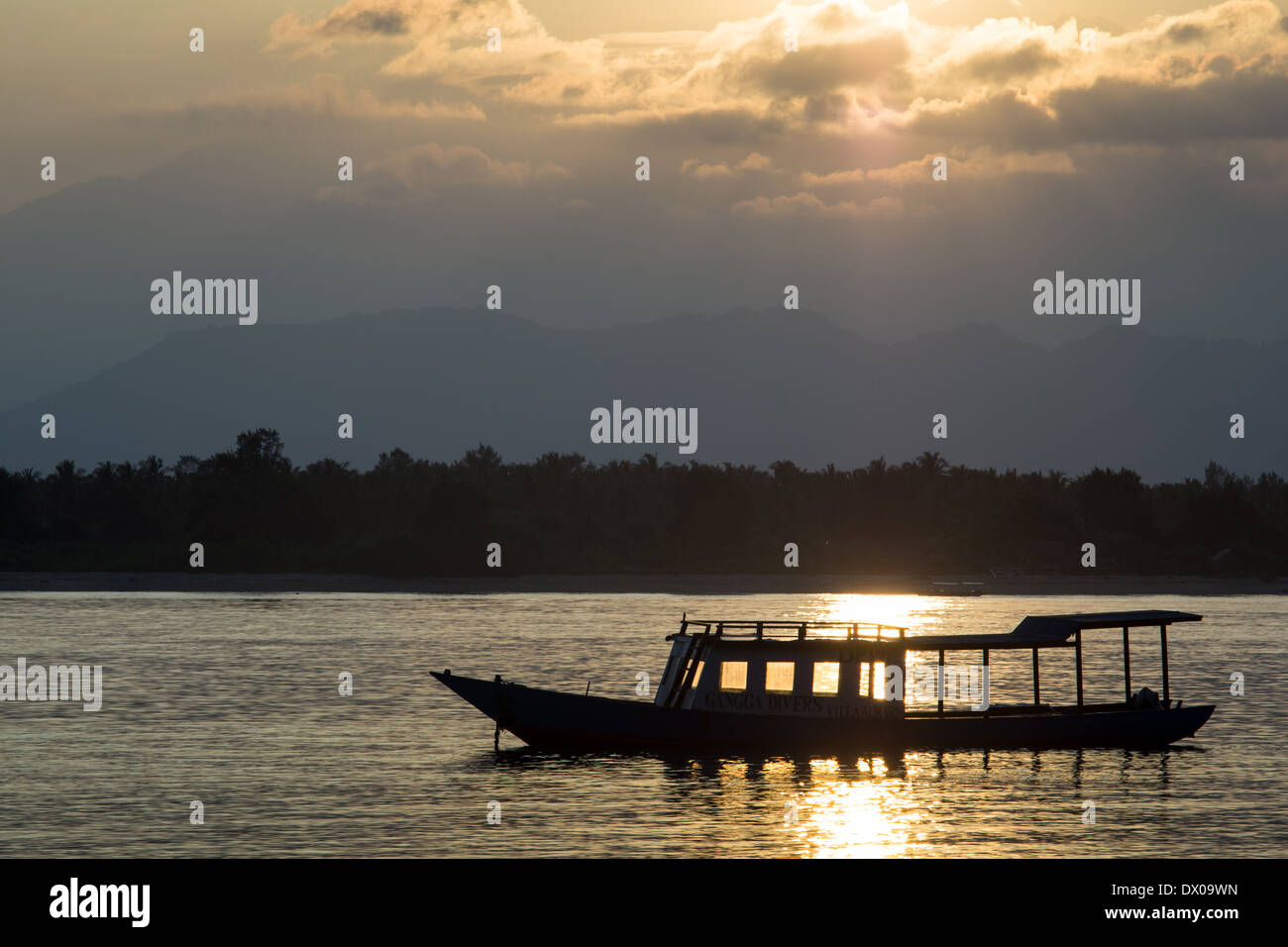 Silhouette of boat at sunset, Gili islands, Trawangan, Indonesia, Asia Stock Photo