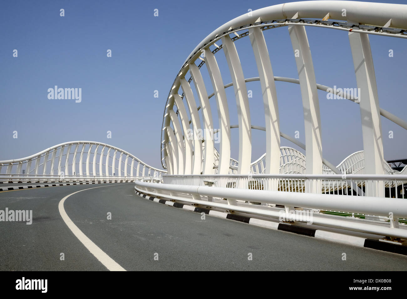 Modern highway bridge at approach to Al Meydan racecourse in Dubai United Arab Emirates Stock Photo