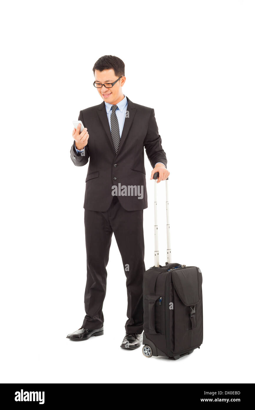 Young businessman holding a cell phone with briefcase Stock Photo