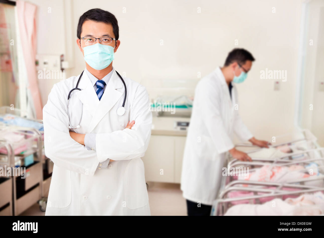 doctor and assistant care fake newborn baby in baby room at doctor and assistant care fake newborn baby in baby room at