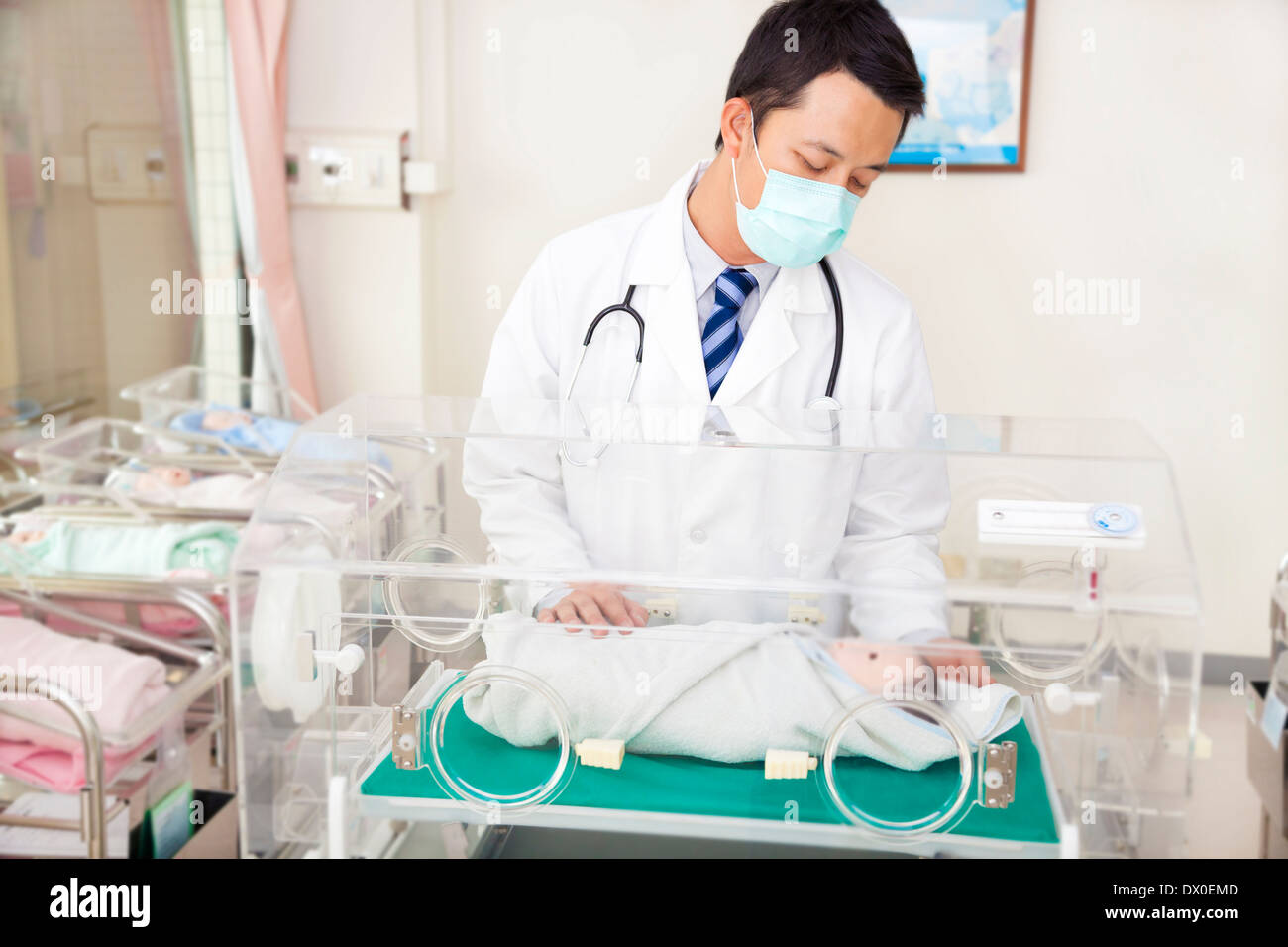 doctor examine a fake infant body situation Stock Photo