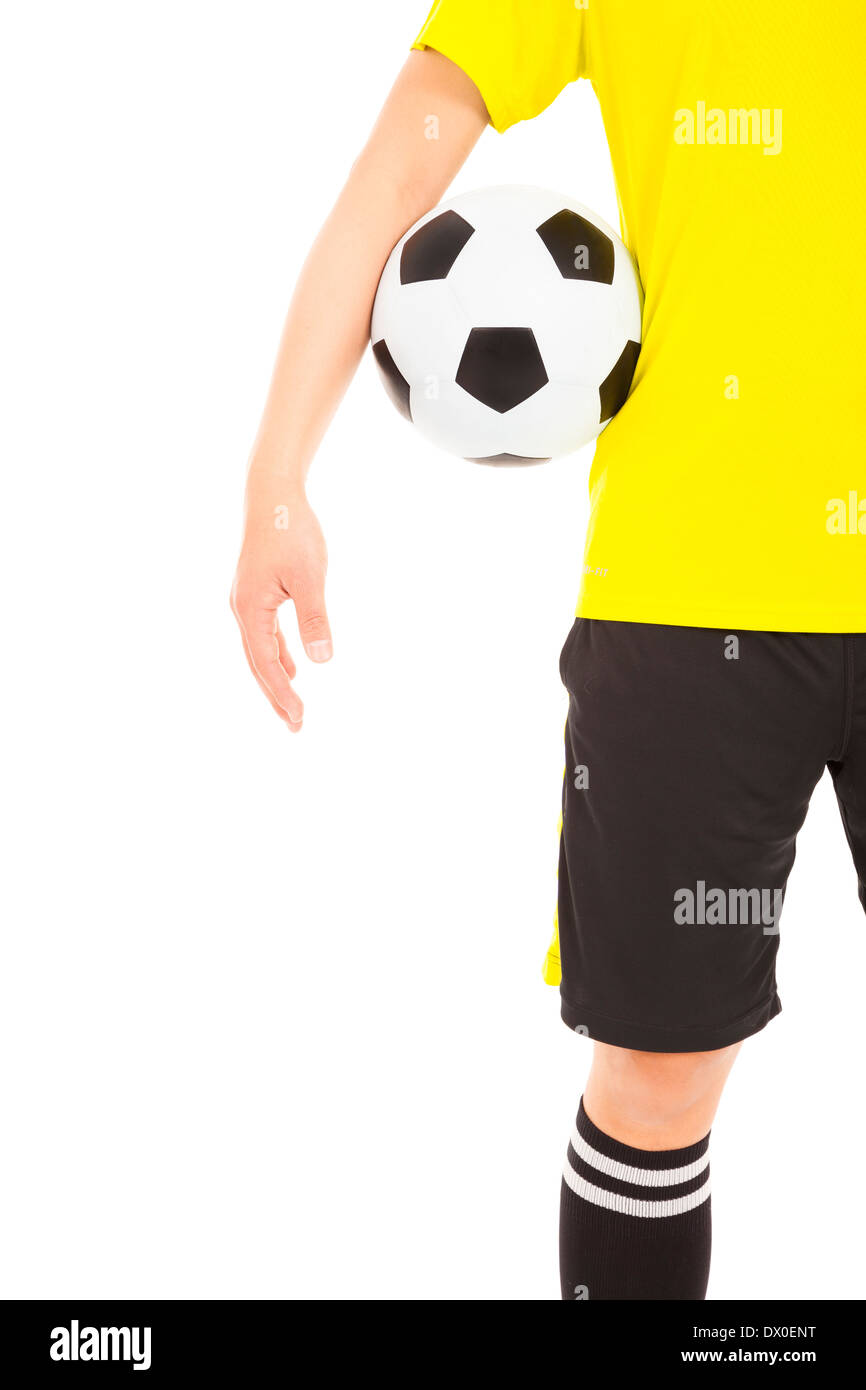 a soccer player holding a ball near waist over white Stock Photo