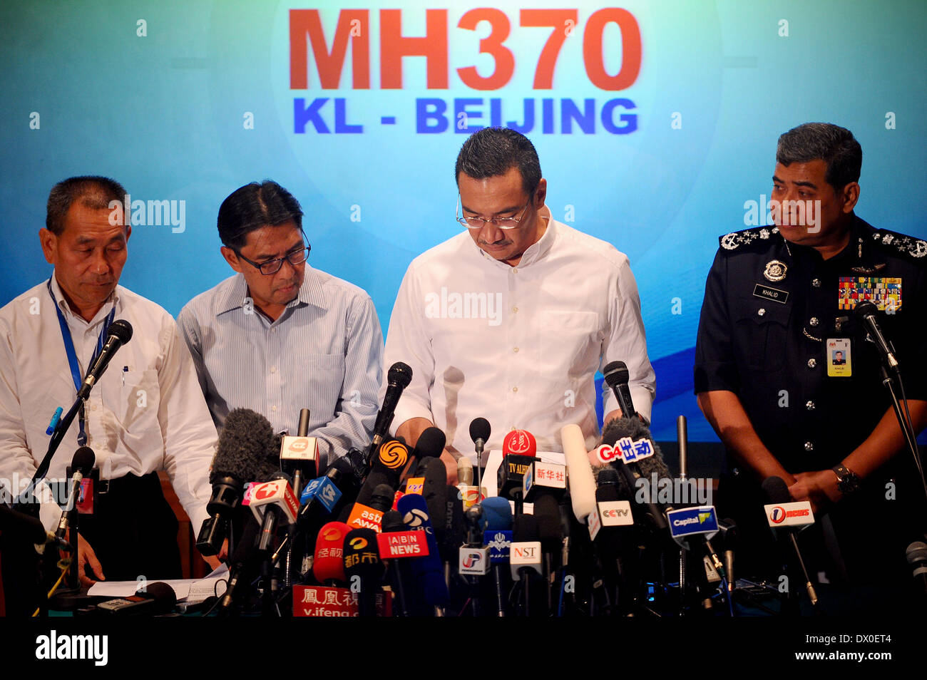 Kuala Lumpur, Malaysia. 16th Mar, 2014. Malaysian Defense&Acting Transport Minister Hishammuddin Hussein accompanied by ( left to right) MAS CEO, Ahmad Jauhari Yahya, Civil Aviation Department (DCA) Director General Azharuddin Abdul Rahman and the Malaysian Police Inspector General, Tan Sri Khalid Abu Bakar during a press conference for the missing Malaysia Airline, MH370 as it closes on its eighth day of disappearance at a hotel in Sepang, outside Kuala Lumpur, Malaysia, Wednesday, March 16, 2014. The Malaysian passenger jet missing for more than a week had its communications deliberately d Stock Photo