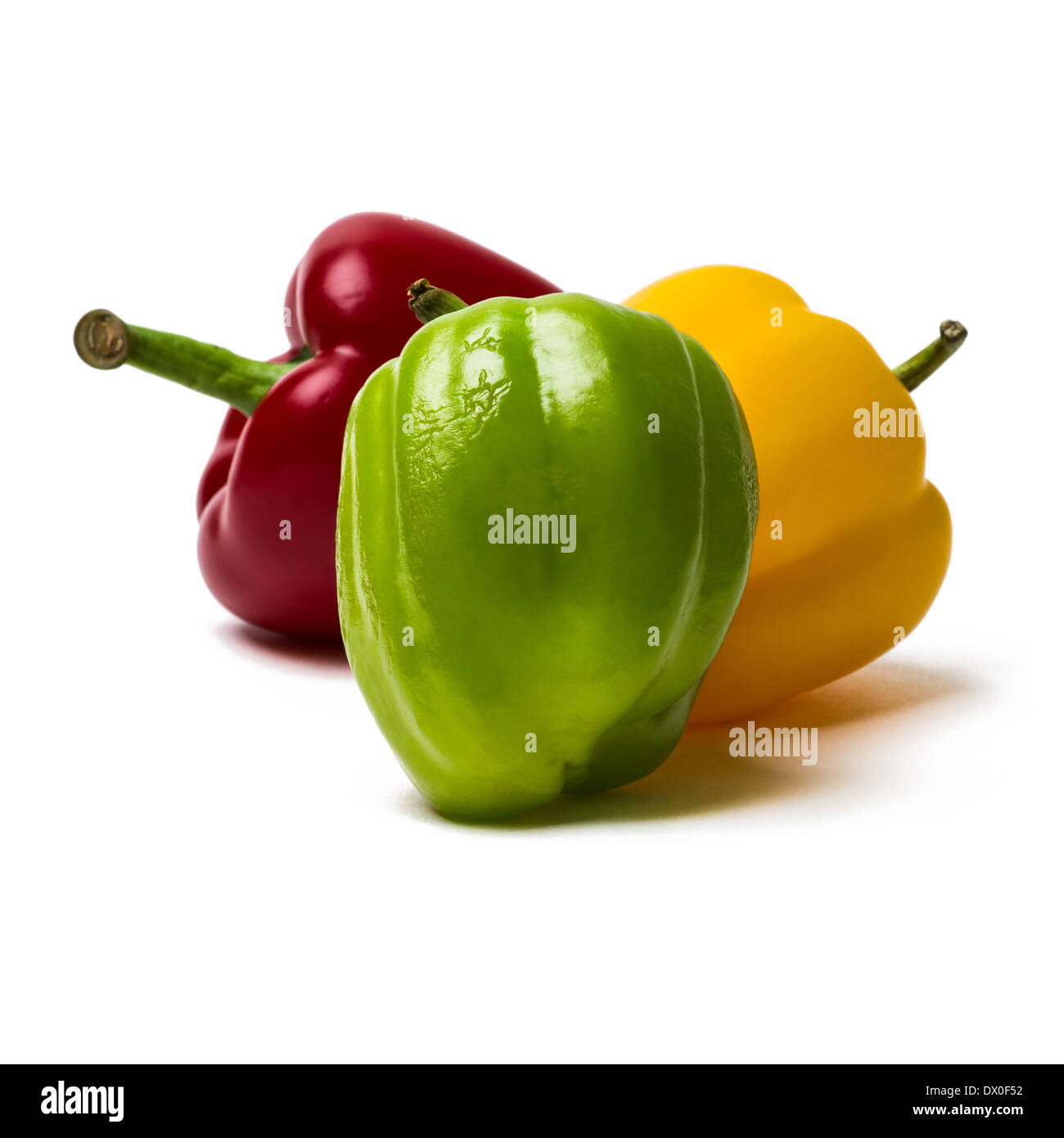 Three sweet peppers of red, yellow and green color. Green pepper is a