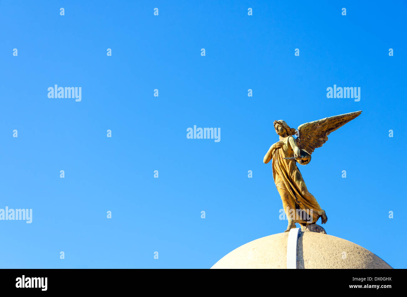 An angel on top of a tomb in the Recoleta Cemetery in Buenos Aires Stock Photo