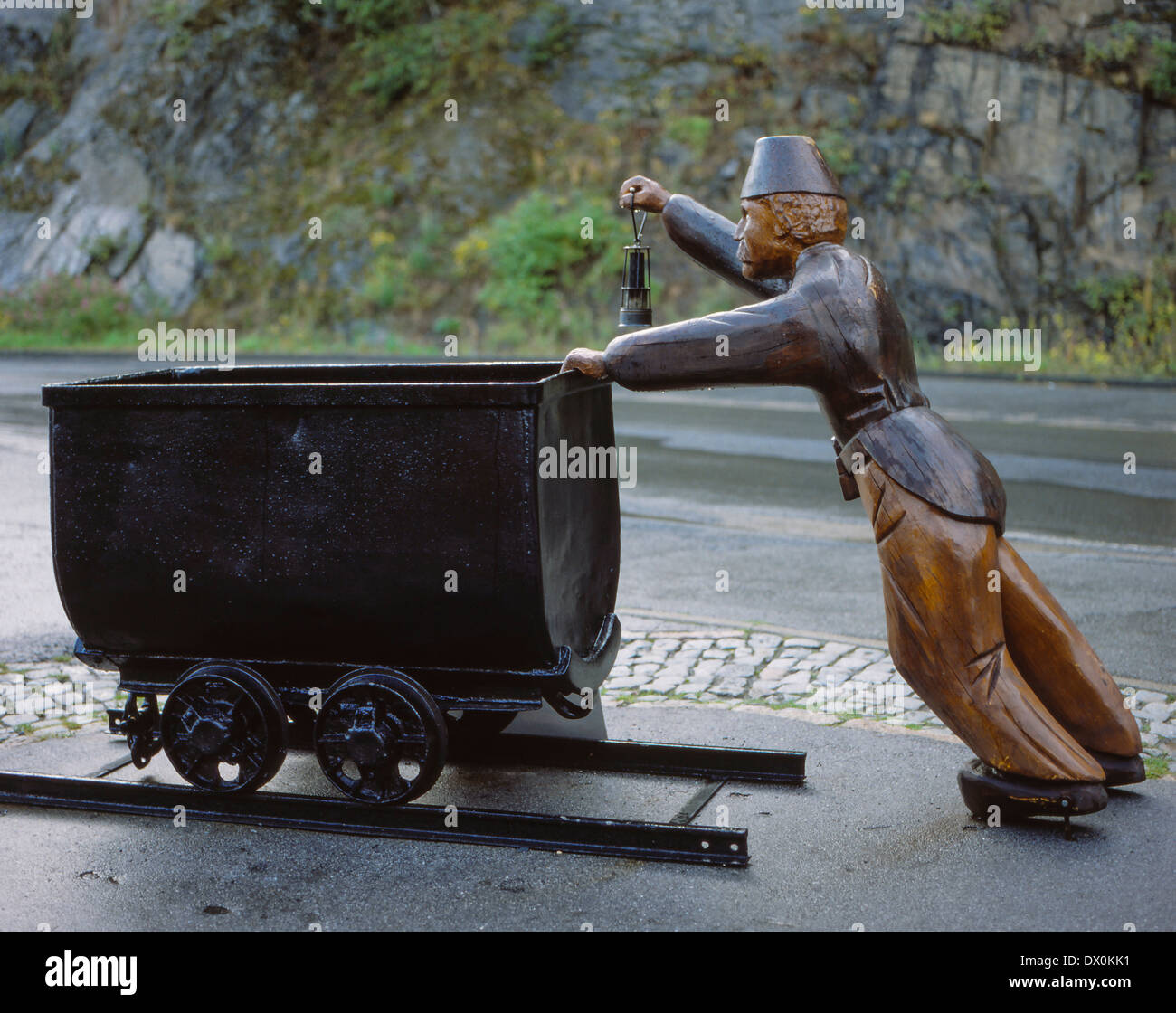 Wooden Mineworker push a wagon, Harz, Germany Stock Photo