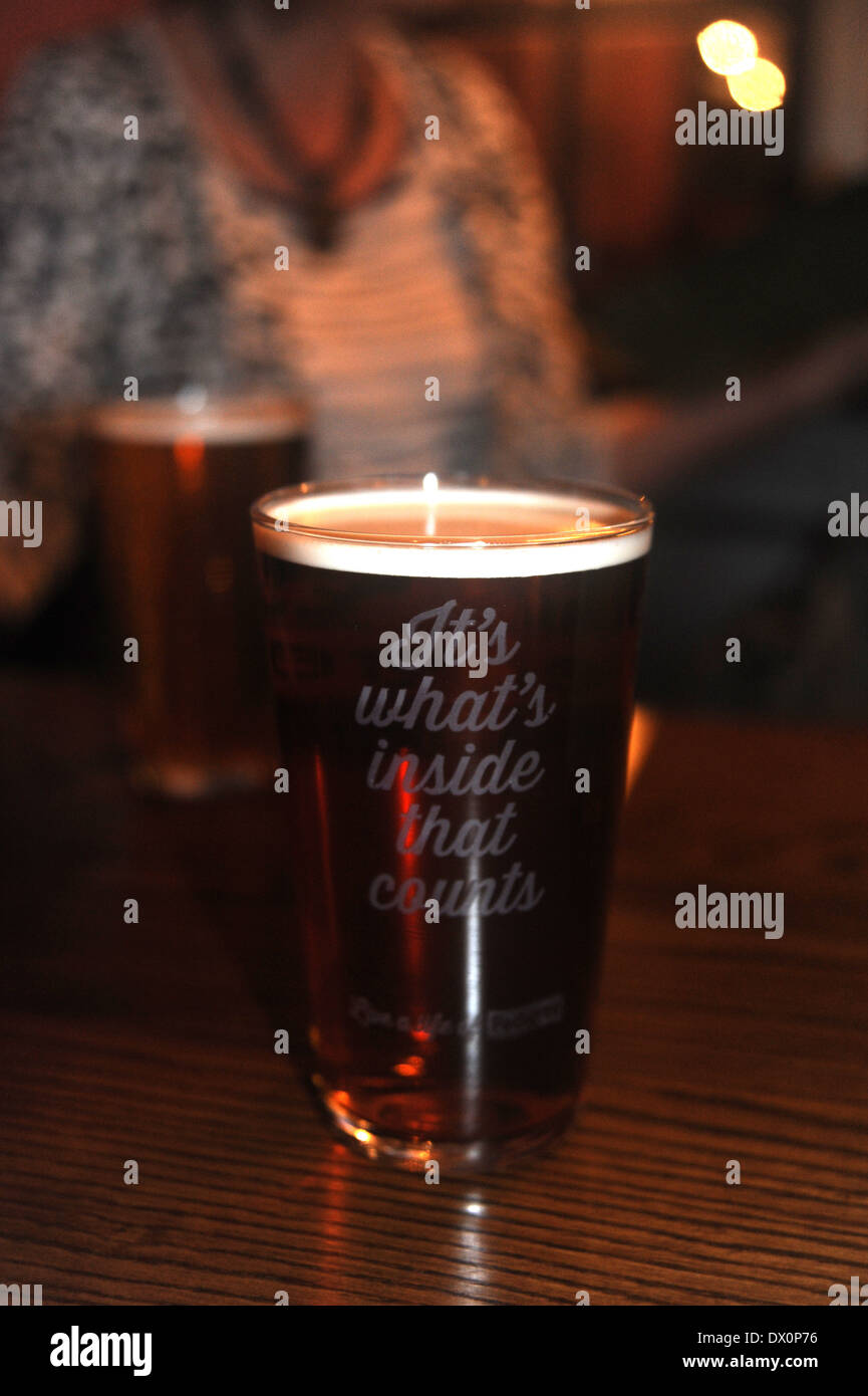 Pint of bitter beer with quotation 'Its Whats Inside That Counts' on