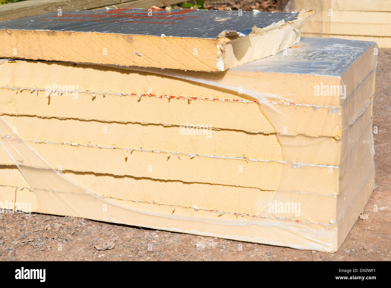 A pile of insulation boards on a construction site Stock Photo