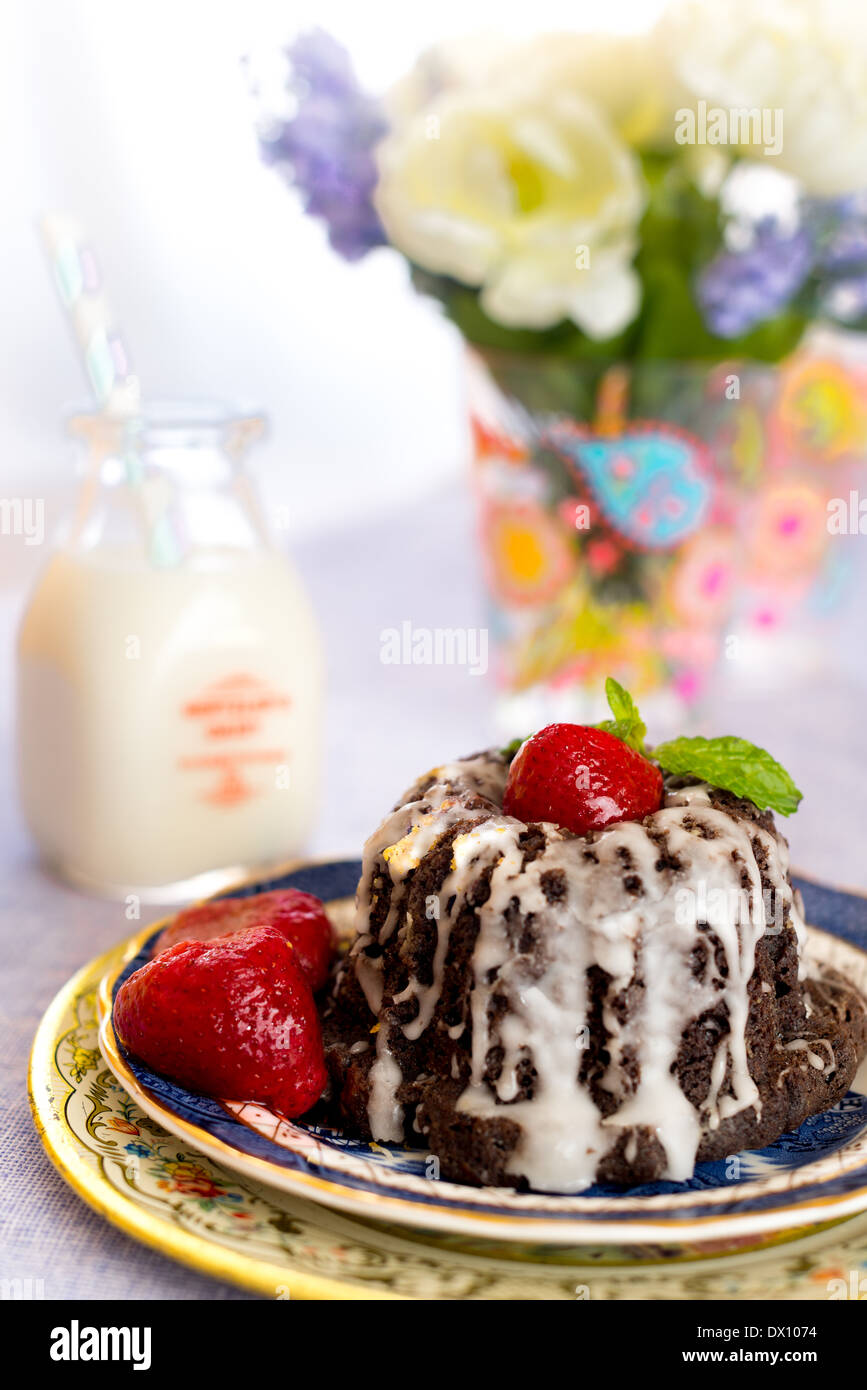 Chocolate Bundt cake with vanilla glaze Stock Photo Alamy