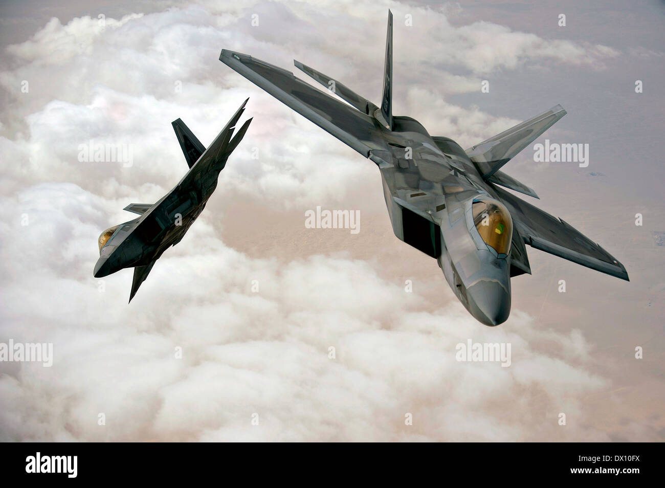 US Air Force F-22 Raptors fly in formation during a training mission December 6, 2009 in Southwest Asia. Stock Photo