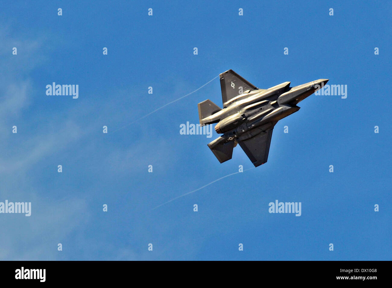 A US Air Force F-35 strike fighter aircraft flies overhead before landing for the first time at Luke AFB March 10, 2014 in Glendale, Arizona. Stock Photo