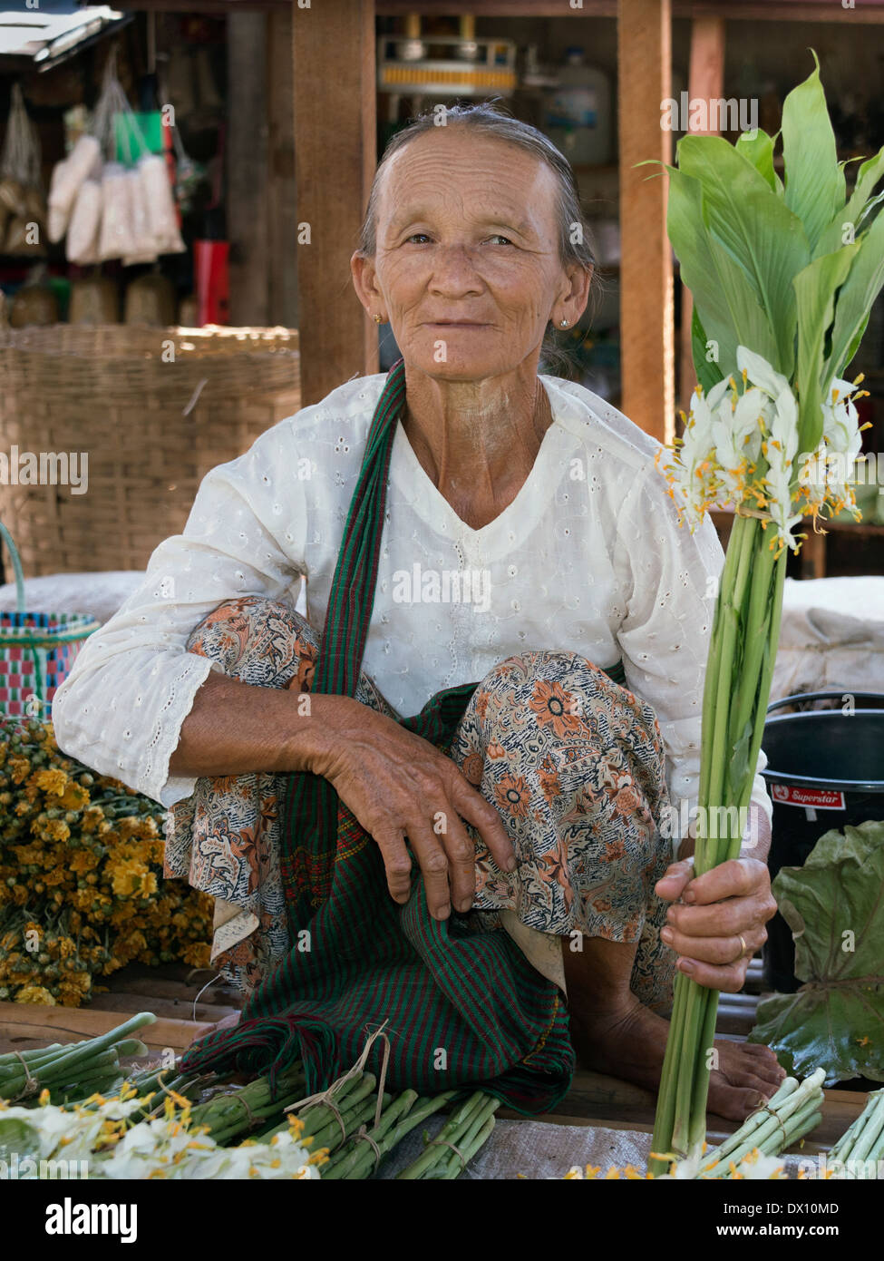 Woman selling flowers in the market, Nyaungshwe, Inle Lake, Myanmar Stock Photo