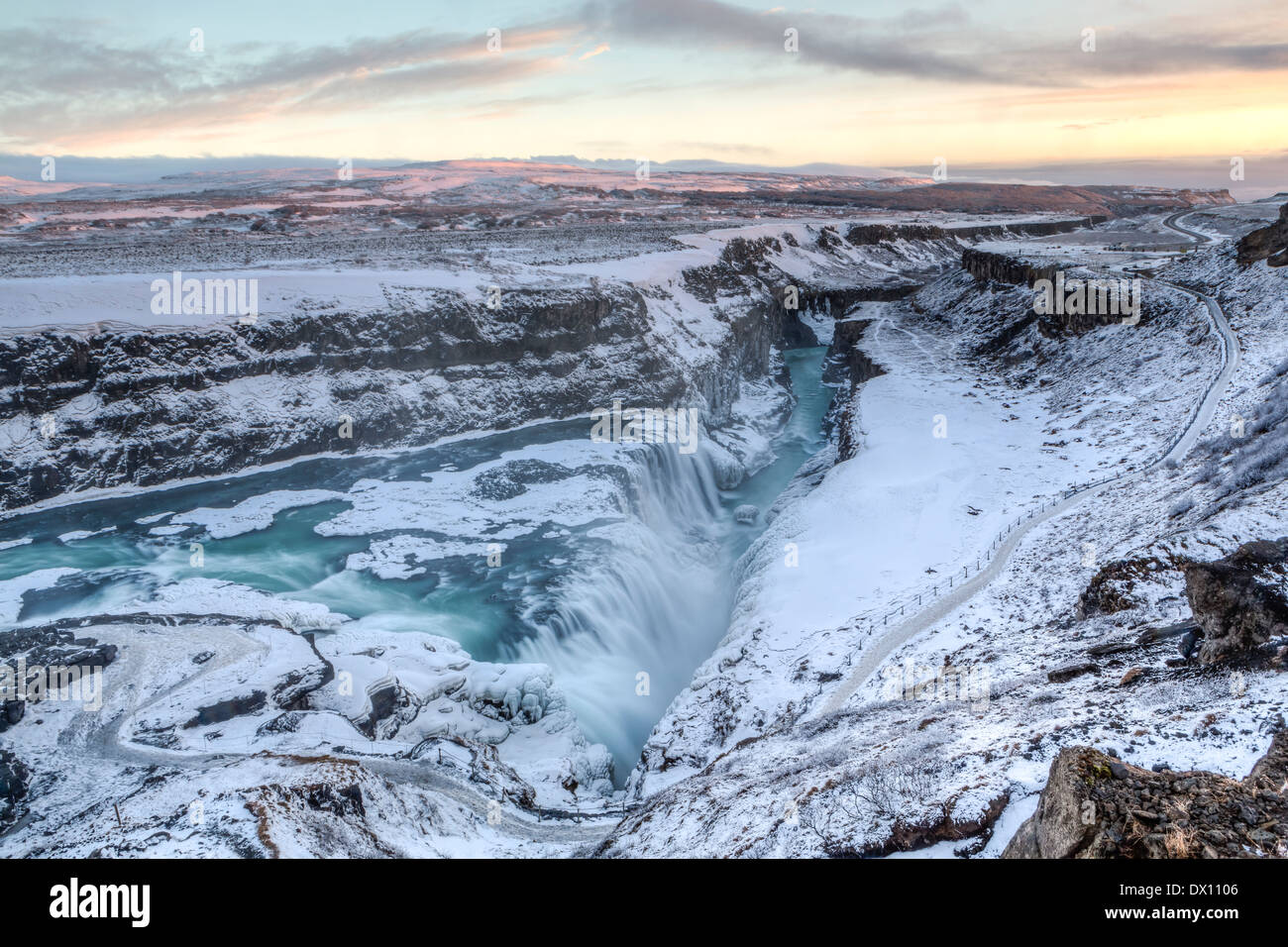 Majestic Gullfoss falls into a wintry gorge at sunset in Western Iceland Stock Photo