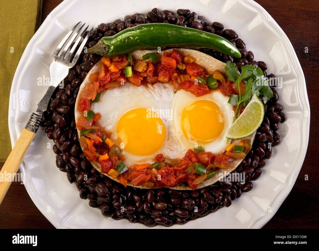 Mexican flour tortilla, salsa, peppers and eggs. Stock Photo