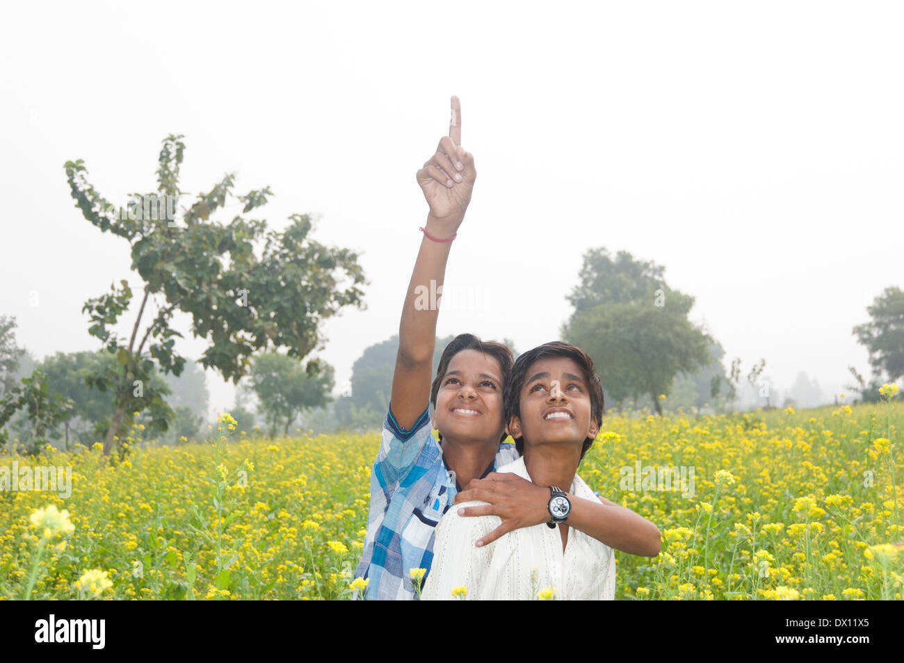 Indian Kids Standing in Farm Stock Photo
