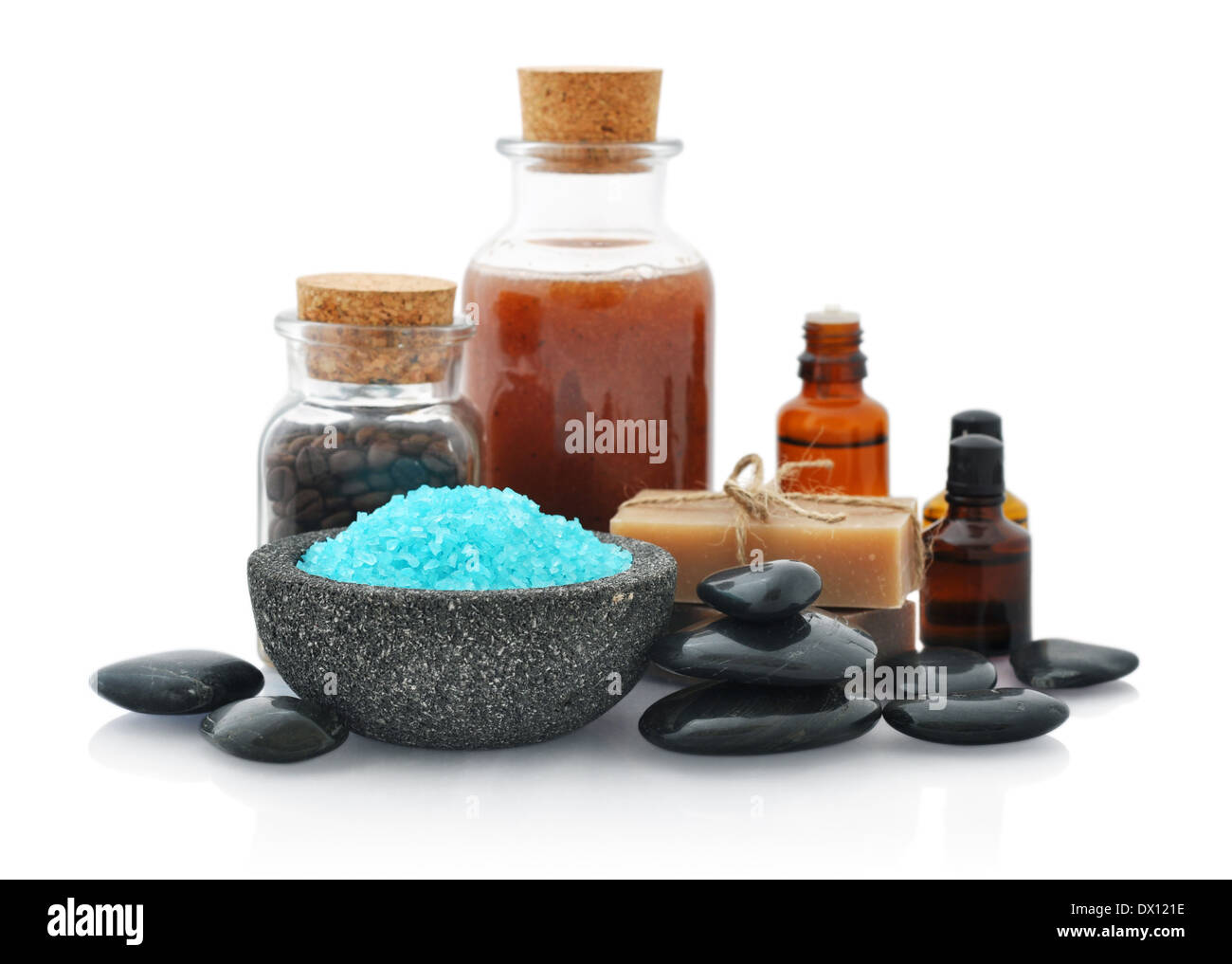 Spa composition with sea salt and massaging stones isolated on white background Stock Photo