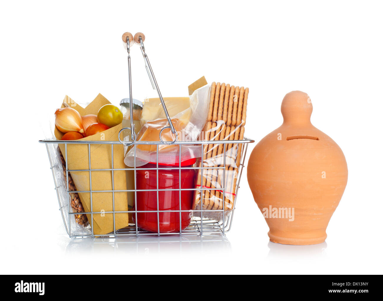 The shopping basket with various food and money box on white Stock Photo