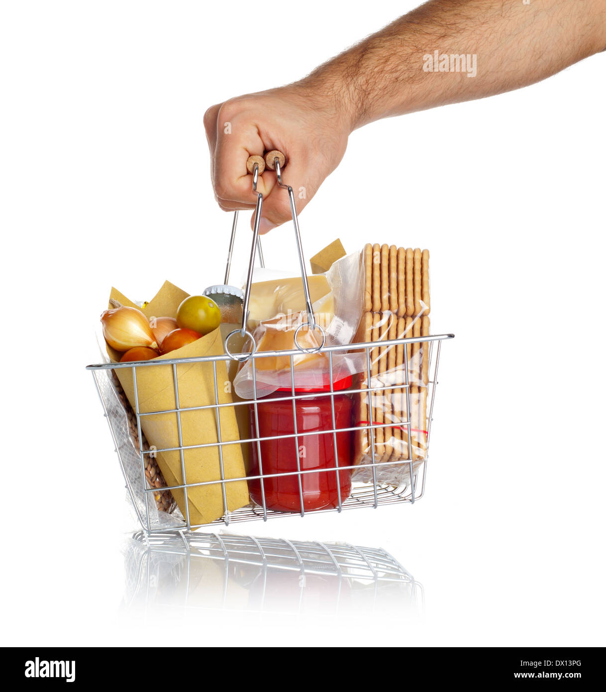 Man takes the shopping basket with various food on white Stock Photo