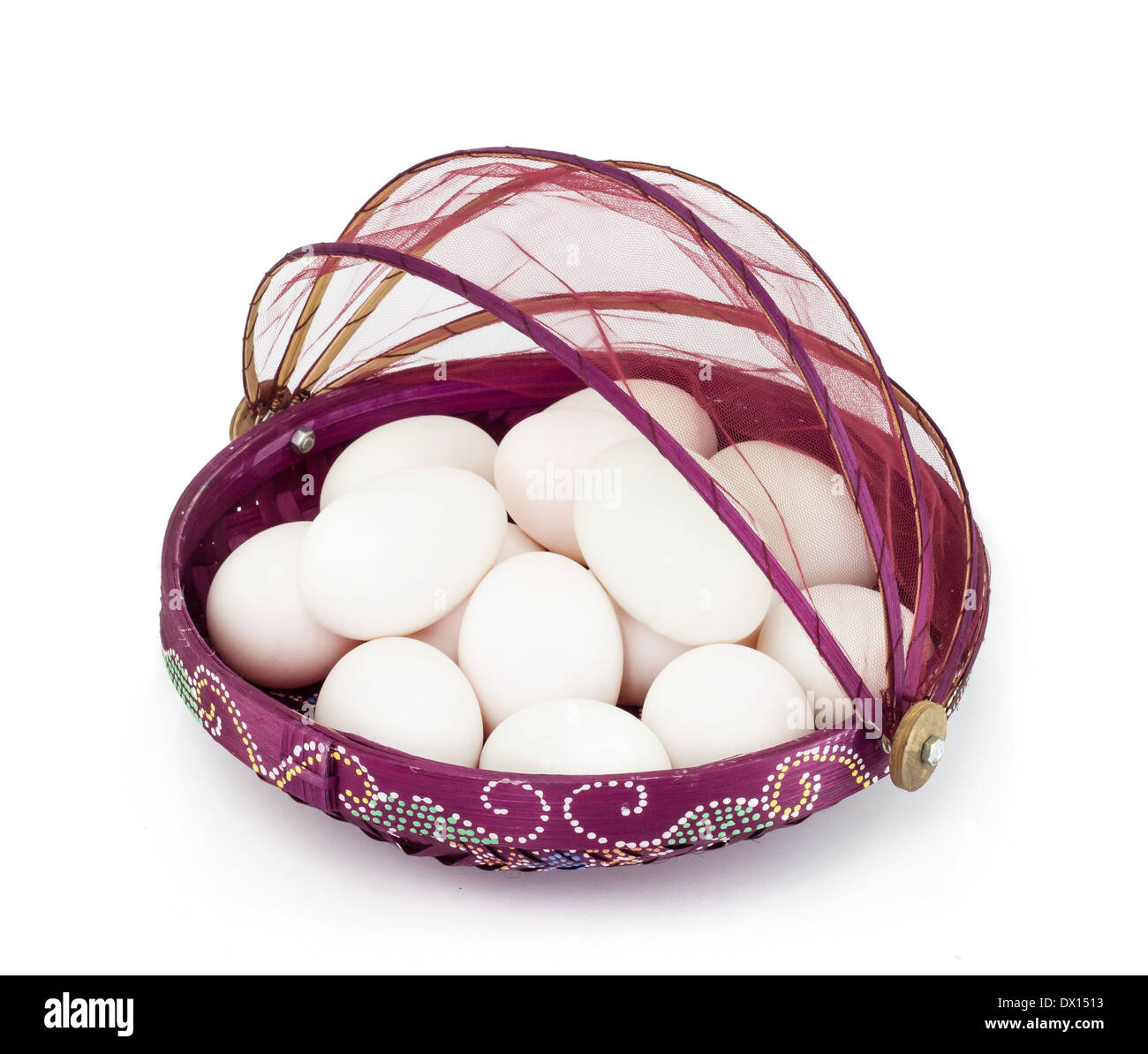 Egg in violet basket on white background Stock Photo Alamy