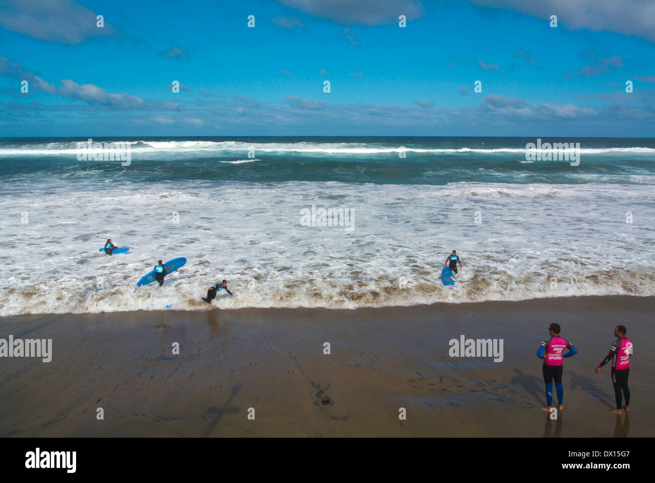 Surfers, Playa Chica beach, Las Palmas de Gran Canaria, Canary Islands, Spain, Europe Stock Photo