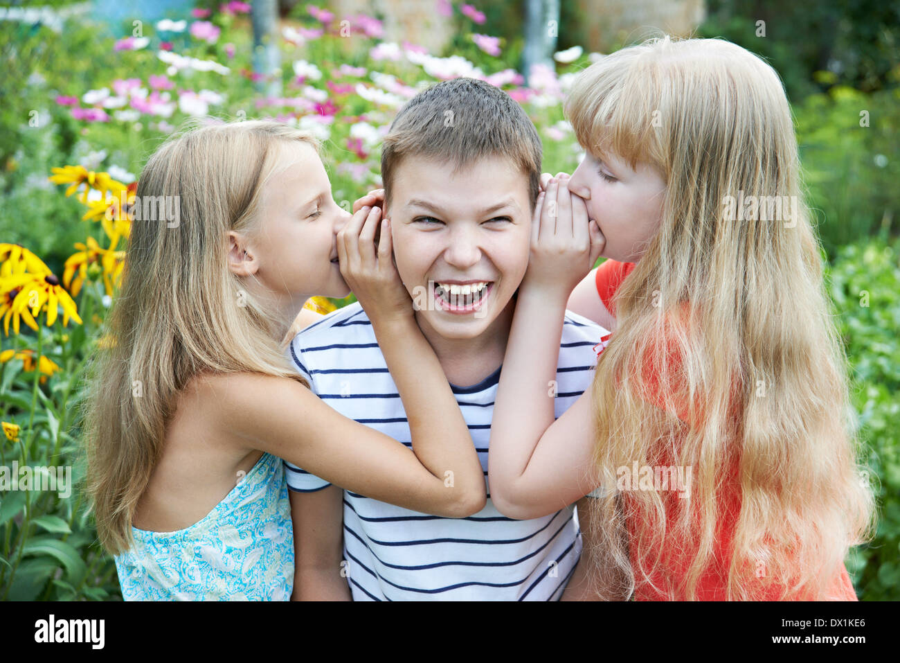 Sister whispered to his brother about the secrets Stock Photo