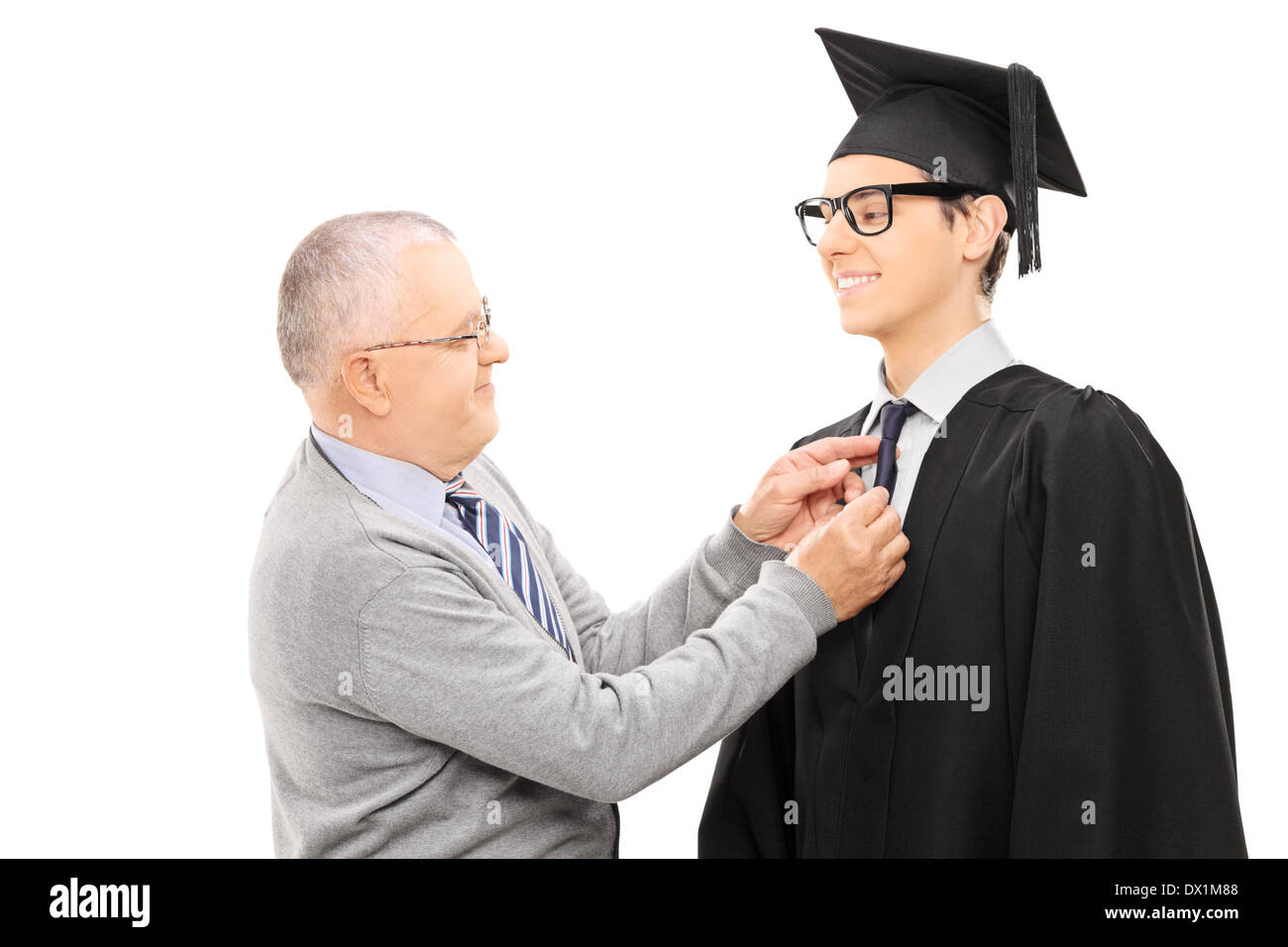 Proud father preparing his son for graduation Stock Photo