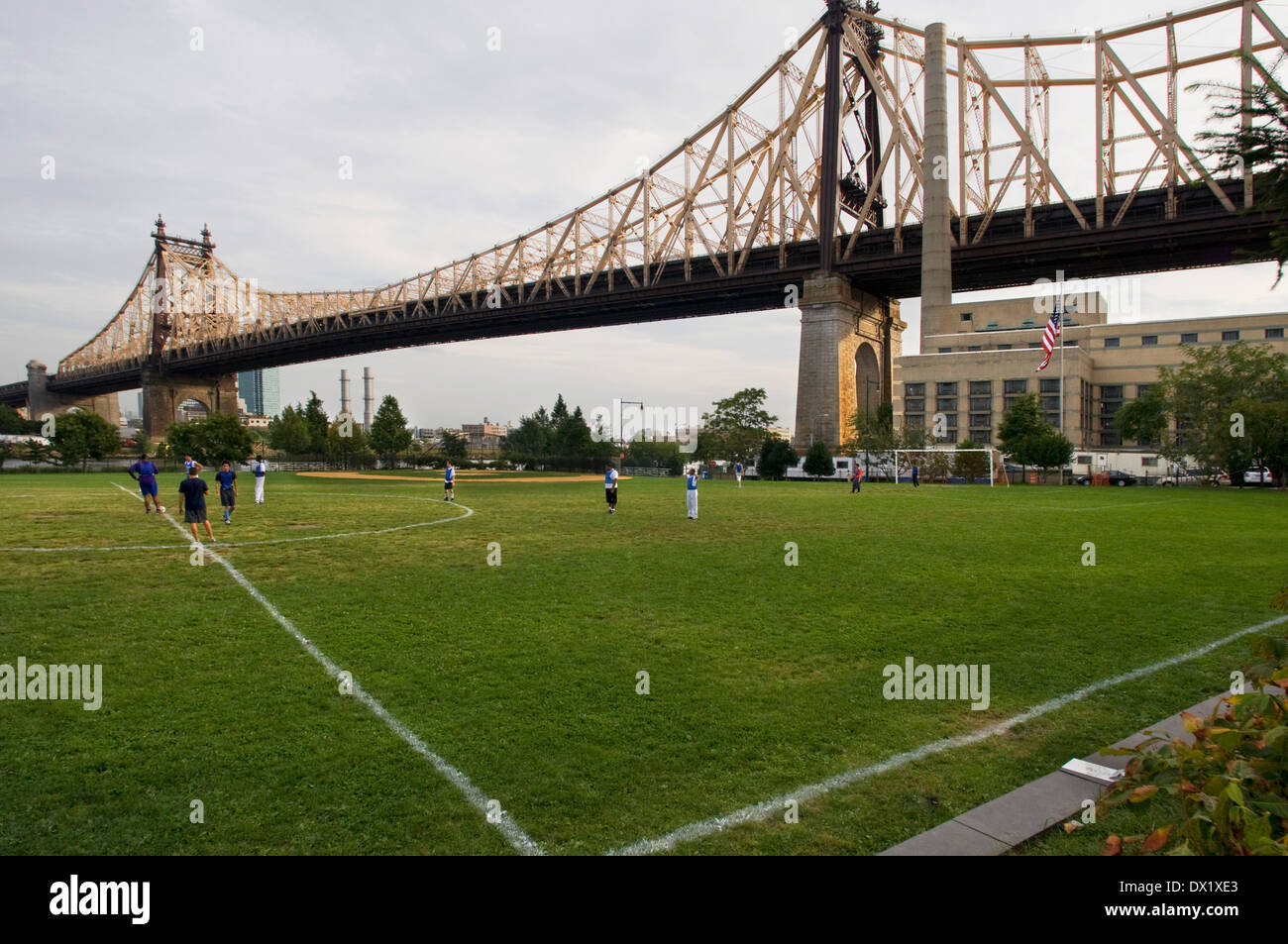 Soccer field under the Queensboro Bridge on Roosevelt Island . Roosevelt Island is located in the East River between Manhattan Stock Photo